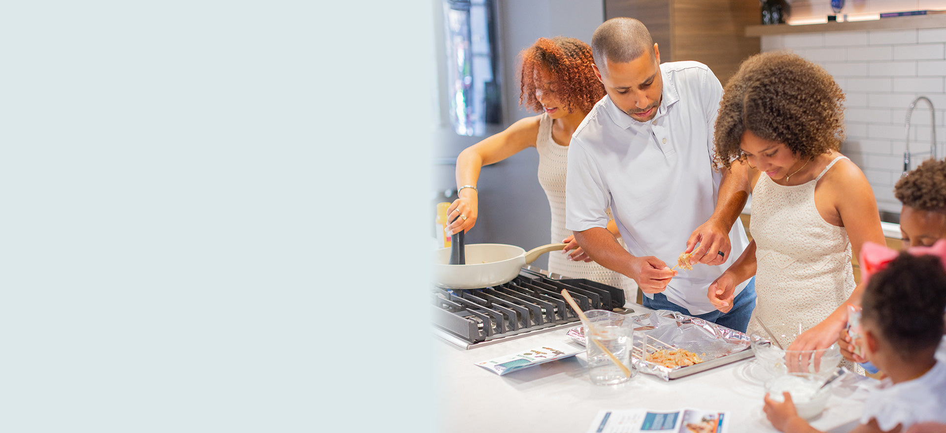 Family cooking together in kitchen