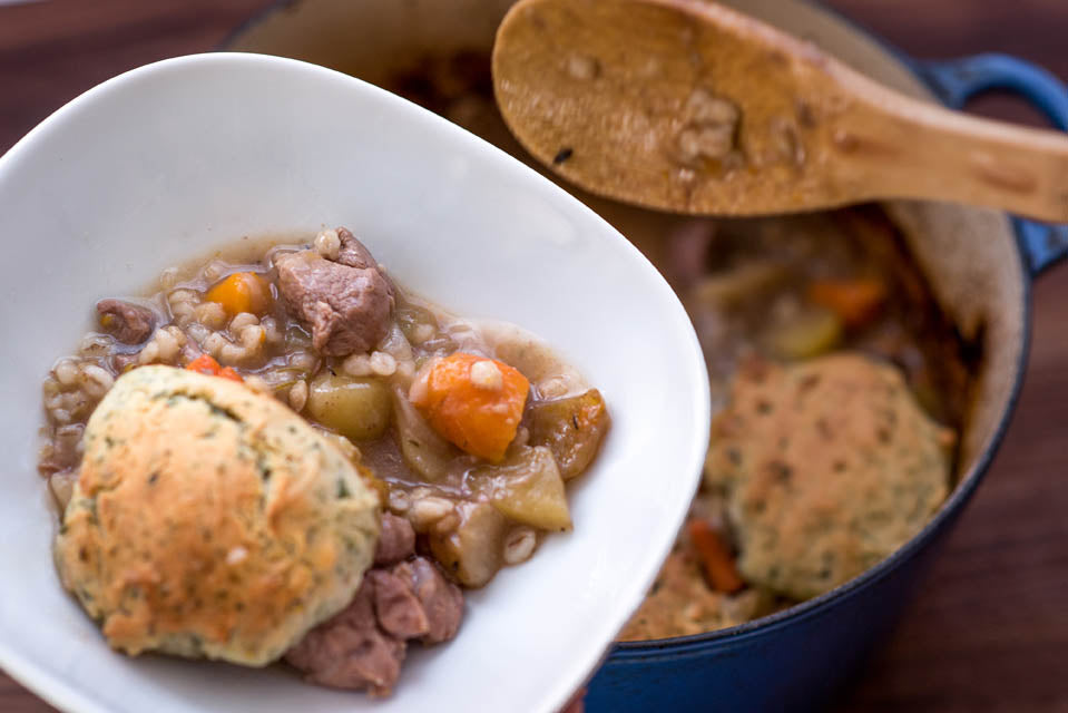 hearty lamb stew with vegetables and dumpling in pot