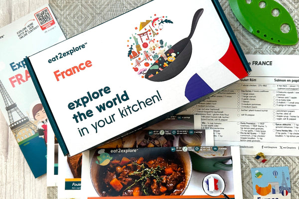 Explore France culinary kit with recipe cards and kitchen tool.