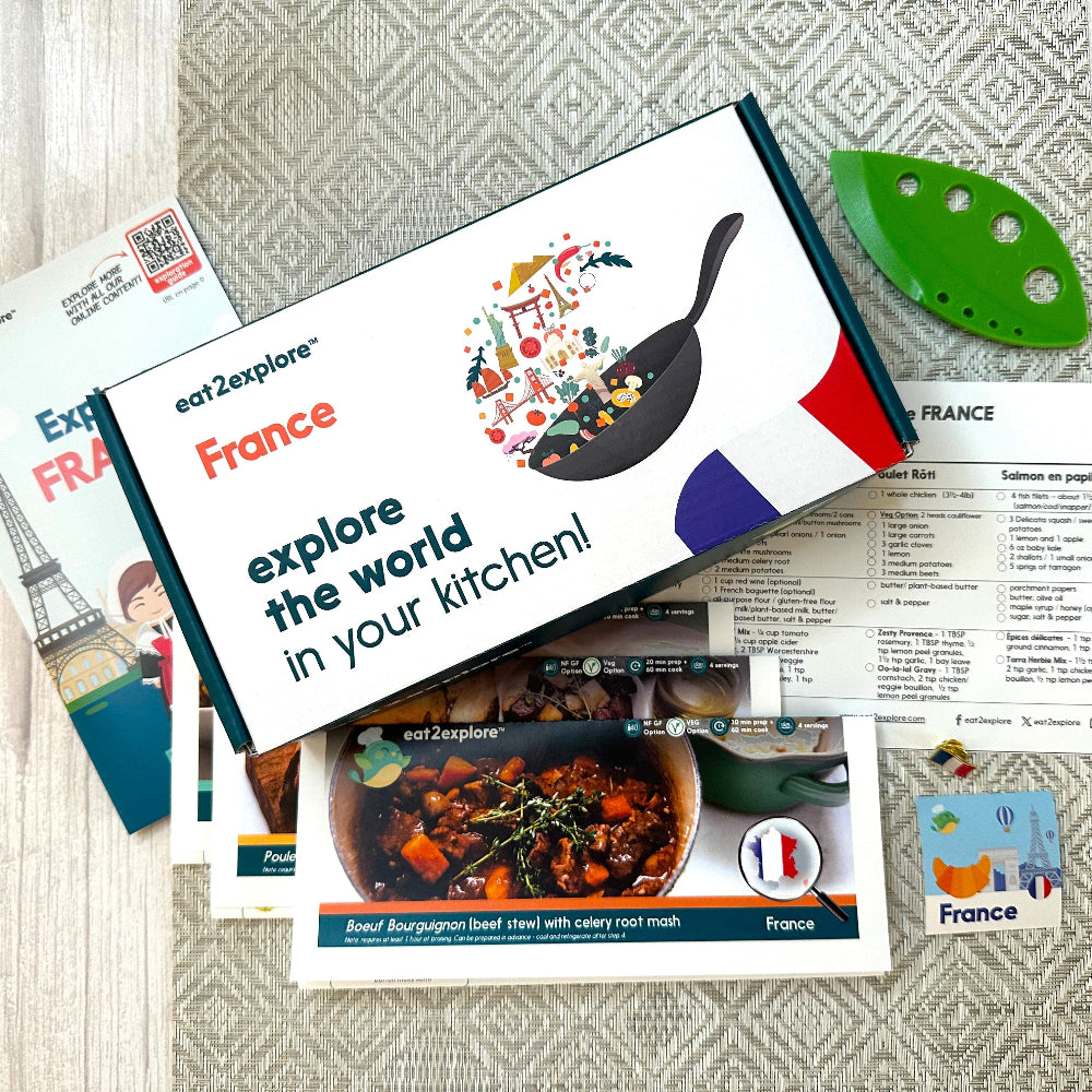 Explore France culinary kit with recipe cards and kitchen tool.