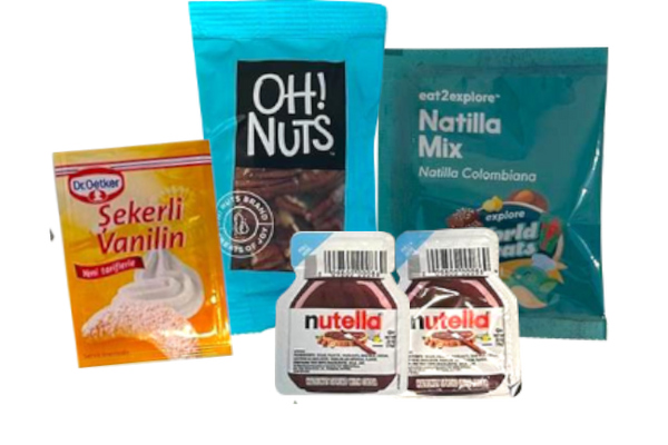 Assorted food items including a packet of 'Oh! Nuts', a jar of 'Nutella', and a packet of 'Nathilla Mix' on a white background.