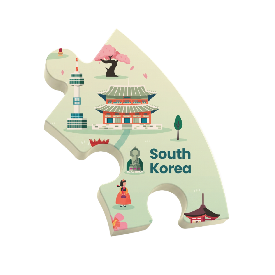 A single puzzle-piece-shaped sticker or plaque featuring a stylized illustration of South Korea, including a temple, cherry blossom tree, tower, traditional dancer, and the text 'South Korea' on a white background.