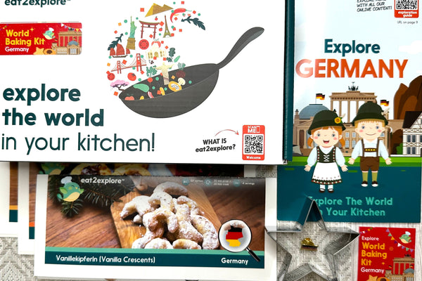 Educational kits for cooking and learning about different countries on a textured surface