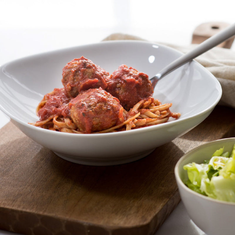 spaghetti and meatballs with salad