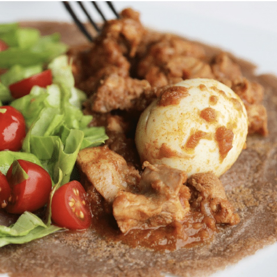 ethiopian dish injera chicken egg lettuce tomatoes